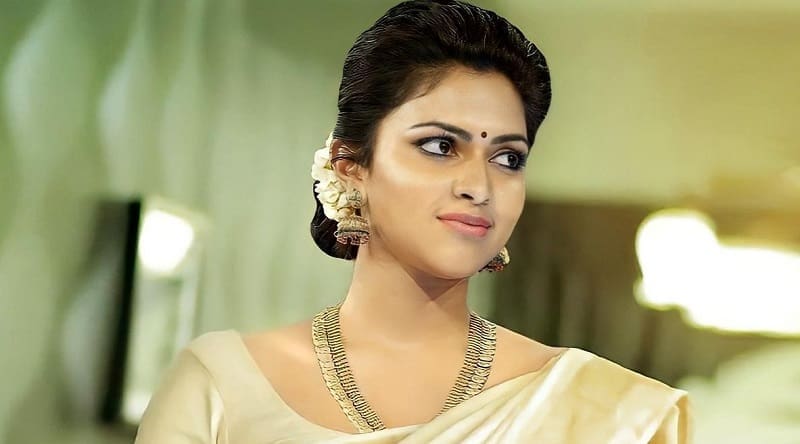 Amala Paul dancing with a bottle of wine in her hand