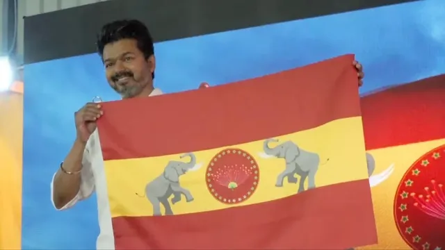 vijay hoisting the official flag